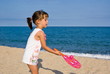 Girl playing on the beach