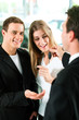 Car sales - key being given to couple