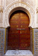 Ornate exterior wooden door of mosque