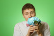Lover man "nerd" with a bouquet of flowers