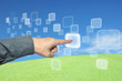 hand pushing a button on a touch screen interface