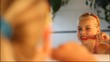 Video: little girl brushing her teeth in front of a mirror little girl brushing her teeth in front of a mirror