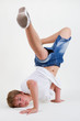 Teen b-boy standing on his head in freeze Teen b-boy standing on his head in freeze