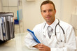 Young doctor man with stethoscope and clipboard