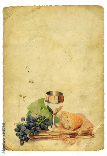 Photo: Holy comunion elements on old paper background. Isolated on whit Holy comunion elements on old paper background. Isolated on whit