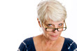 Photo: Mature woman looking over her glasses Mature woman looking over her glasses
