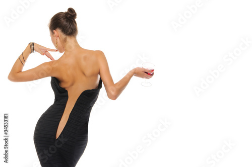 Photo: woman with an unbuttoned dress and glass of wine woman with an unbuttoned dress and glass of wine
