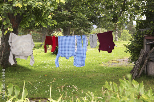 Photo: Clothes hanging on clothesline to dry Clothes hanging on clothesline to dry