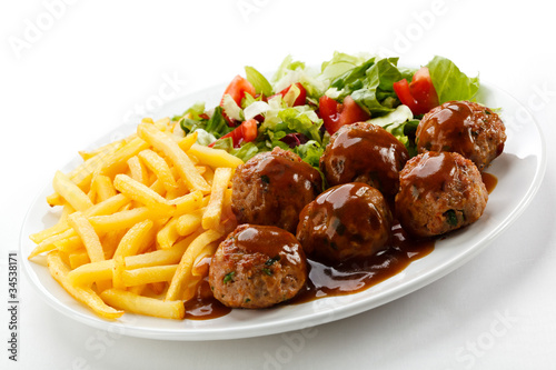 Photo: Roasted meatballs, French fries and vegetable salad Roasted meatballs, French fries and vegetable salad
