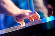 Hand on piano keyboard