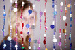 portrait of girl not in focus which stands behind curtain