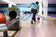 Man exactly throws up ball on skittles in bowling club Man exactly throws up ball on skittles in bowling club