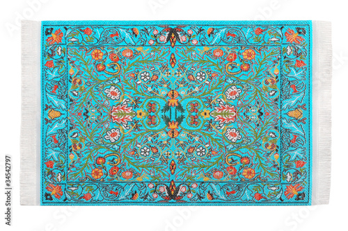 Photo: One turquoise carpet horizontally lies on white background One turquoise carpet horizontally lies on white background
