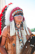 Photo: North American Indian in full dress. Reconstruction North American Indian in full dress. Reconstruction