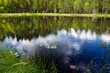 Sky reflection in the lake at forest