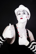 mime in makeup and  white hat