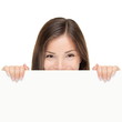 Billboard woman looking over sign
