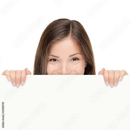 Photo: Billboard woman looking over sign Billboard woman looking over sign