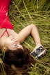 Brunette girl with camera at outdoor.