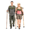Man and woman with backpacks and hiking poles