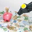Fuel nozzle, piggybank and a lot of money