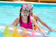 Happy children playing in pool