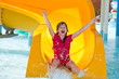 Happy girl on waterslide