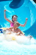 Kids playing on water slide