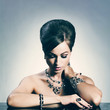 Beautiful woman with evening make-up. Jewelry and Beauty