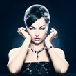 Beautiful woman with evening make-up. Jewelry and Beauty