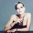 Beautiful woman with evening make-up. Jewelry and Beauty