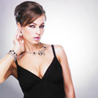 Beautiful woman with evening make-up. Jewelry and Beauty