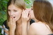 two girls gossip