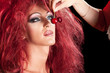 Drag Queen. Man dressed as Woman. On black.