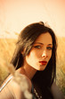 Photo: Closeup portrait of beautiful young girl at sunset Closeup portrait of beautiful young girl at sunset