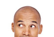 Photo: Young man face looking up at corner Young man face looking up at corner