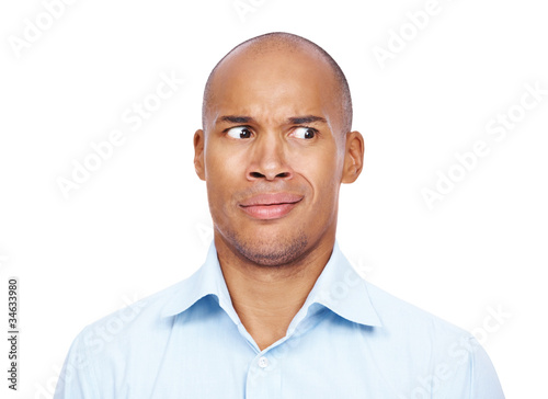 Photo: Frightened young man with funny facial expresion Frightened young man with funny facial expresion