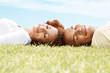 Beautiful couple sleeping on the grass
