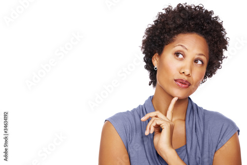 Photo: Afroamerican young woman daydreaming Afroamerican young woman daydreaming