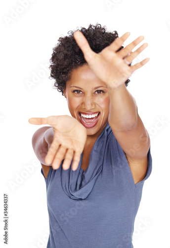 Photo: Excited woman pointing with both hands towards you Excited woman pointing with both hands towards you