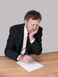 Sad, tired man at desk