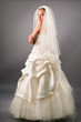 attractive young bride under veil in studio