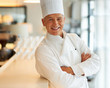 Male chef with hands folded
