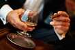 Wealthy man with cigar and cognac Wealthy man with cigar and cognac