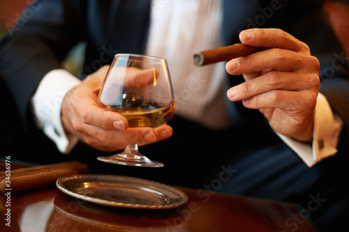 Photo: Man with cigar and cognac Man with cigar and cognac