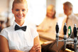 Pretty young barmaid at work