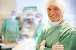 Portrait of smiling doctor in operating room