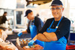 A happy man at his fish shop