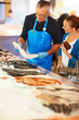 Woman choosing fresh fish