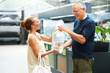 Woman buying fish from man